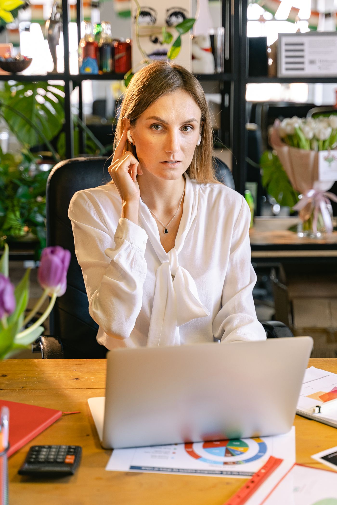 A product professional working at a laptop